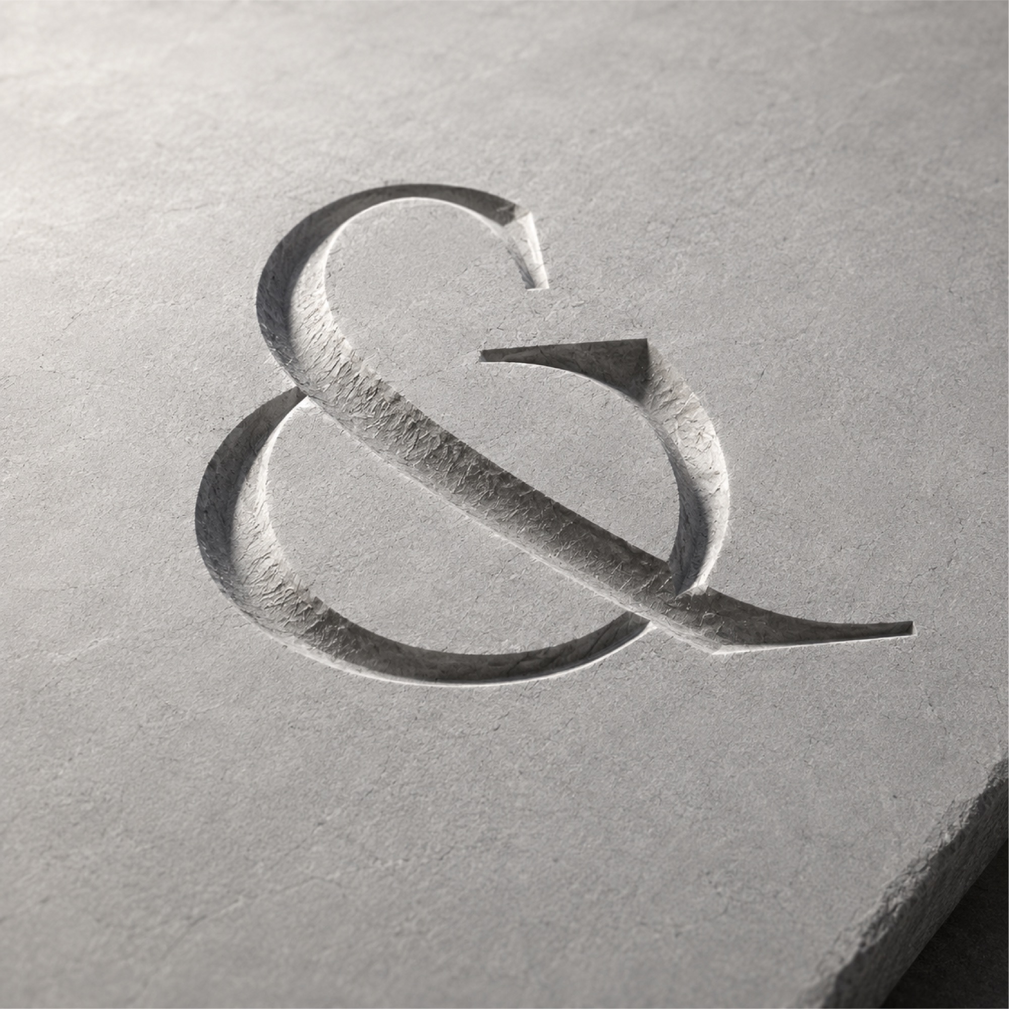 An ampersand carved into a stone slab